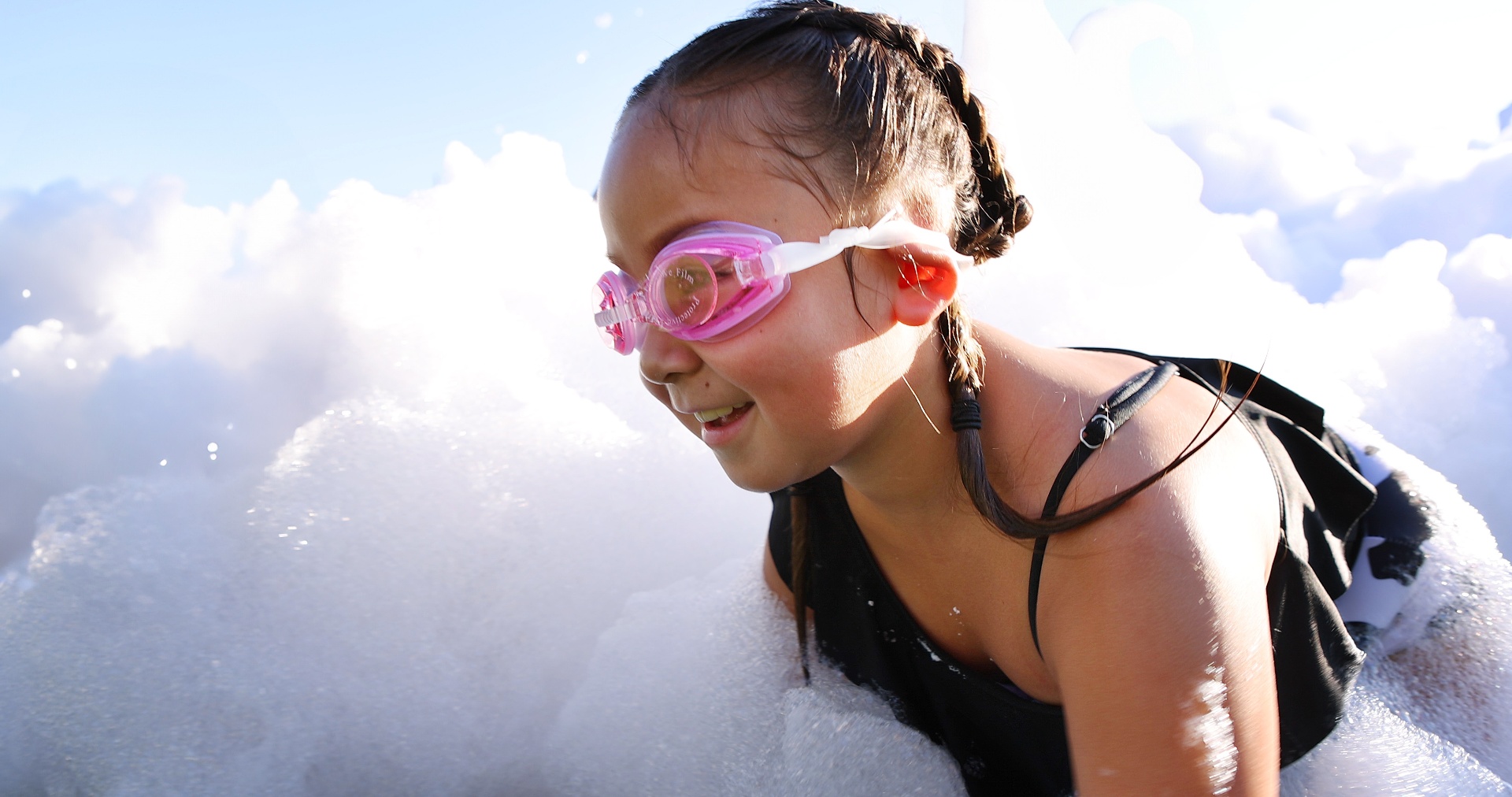 Girl smiling in foam
